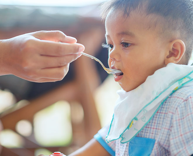 child eating inside image