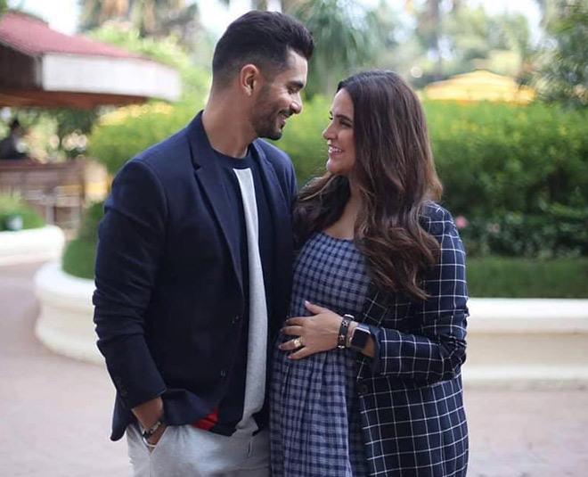 pregnant neha with husband angad bedi