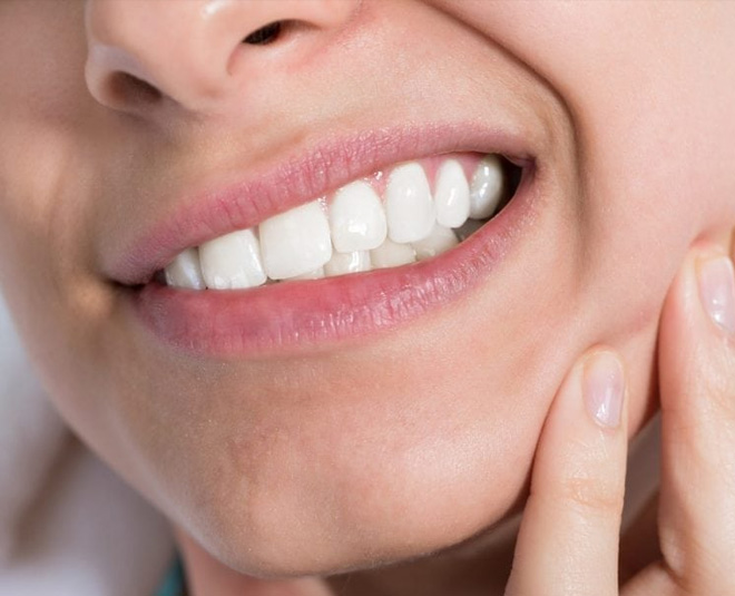 dental problems woman holding jaw