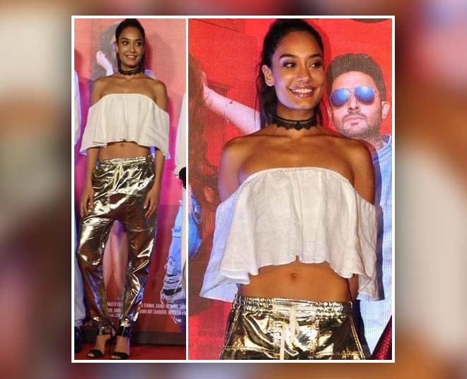 looks stylish in off shoulder dress inside