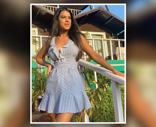 actresses in blue dress inside