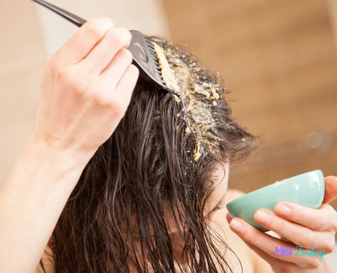 applying papaya on hair inside