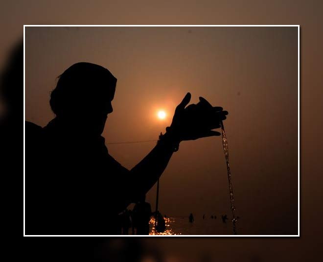 surya dev offering water