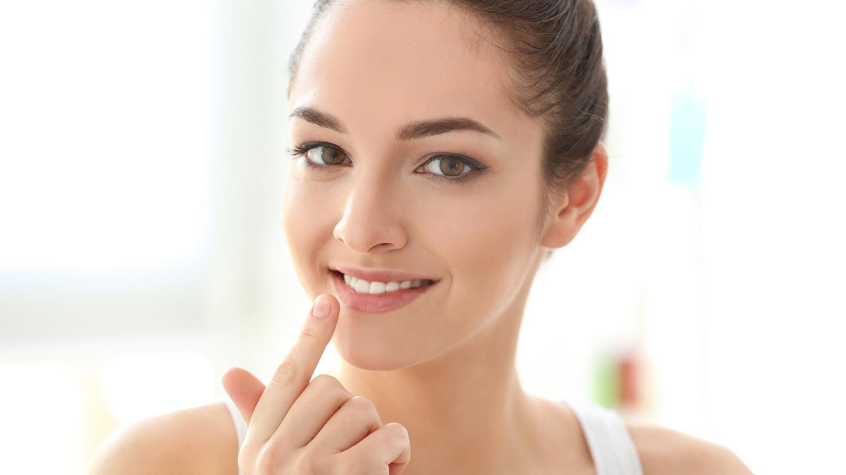 girl touching her lips