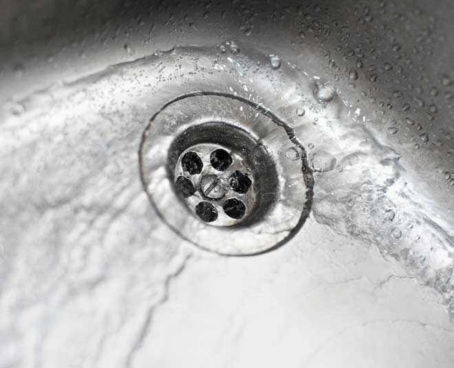 pouring water in the sink