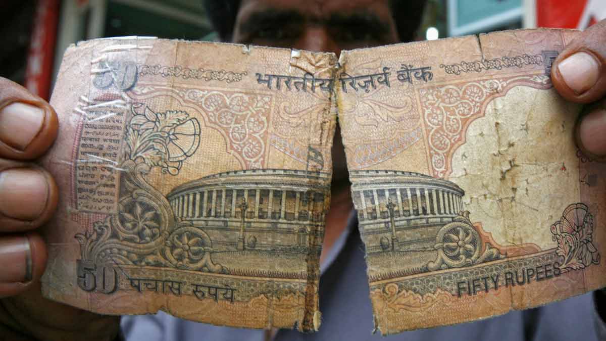 torn rupee note