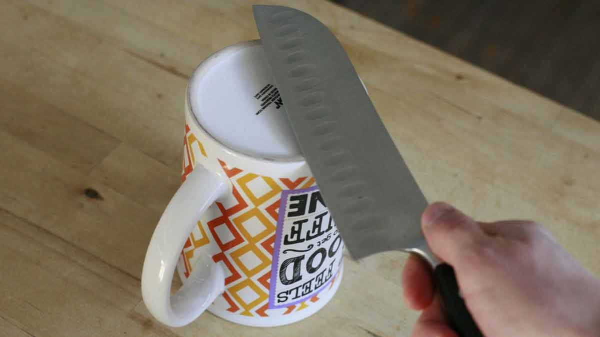 sharpen knife on a coffee mug