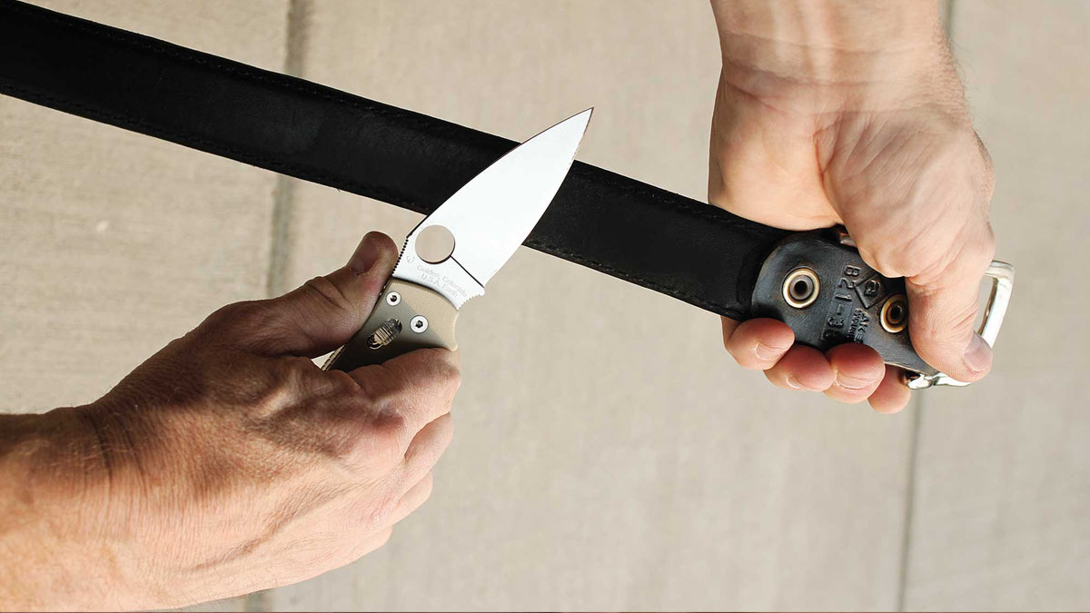 stropping knives on leather belt
