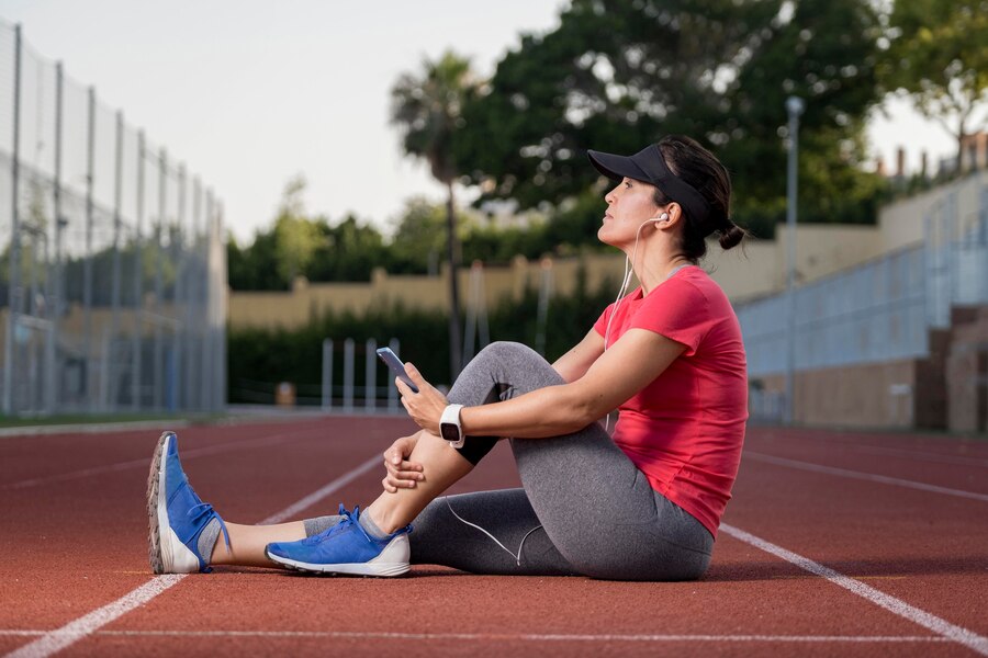 low angle woman resting after running
