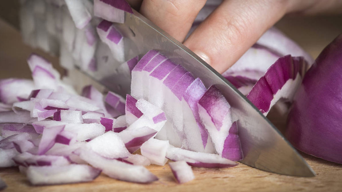chopping onion with knife