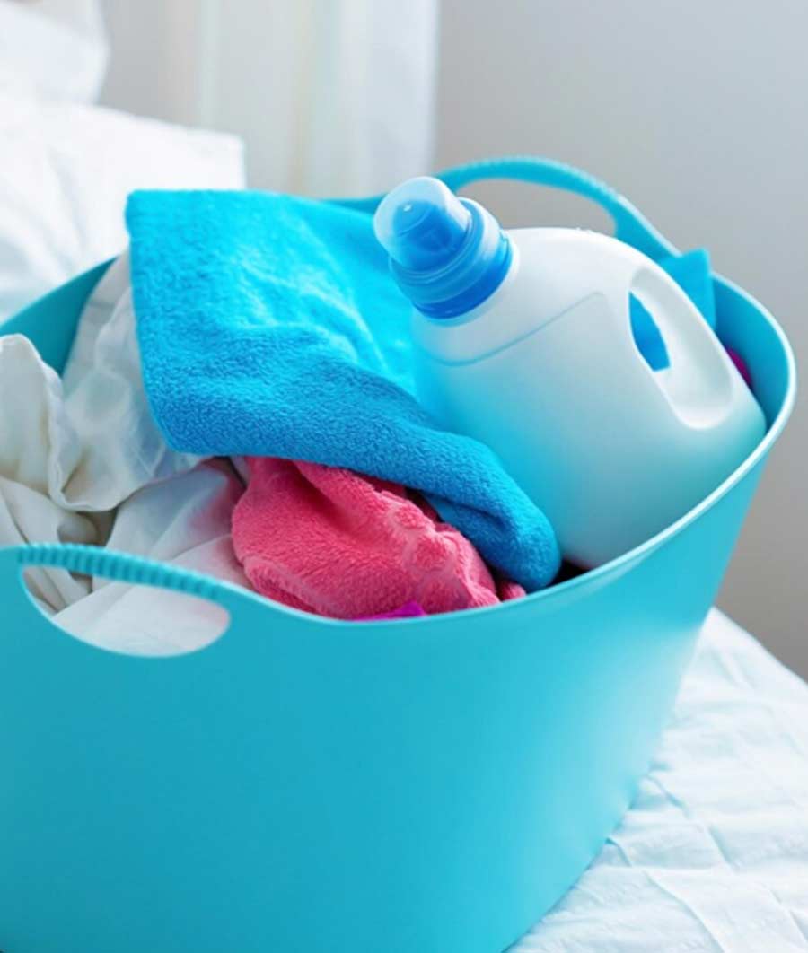 bucket full of dirty clothes