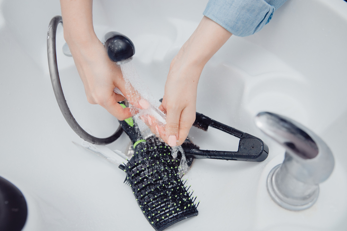 clean hairbrush with soft water