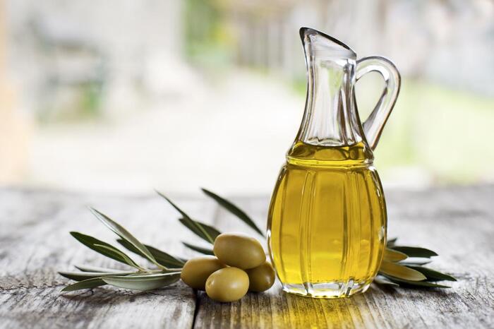 olive oil in a bottle which may