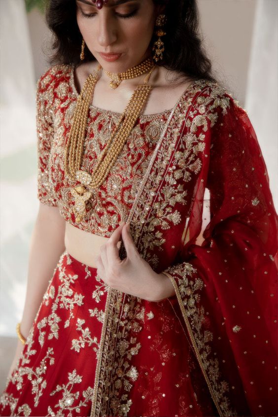 Gold Contrast Jewellery With Red Lehenga