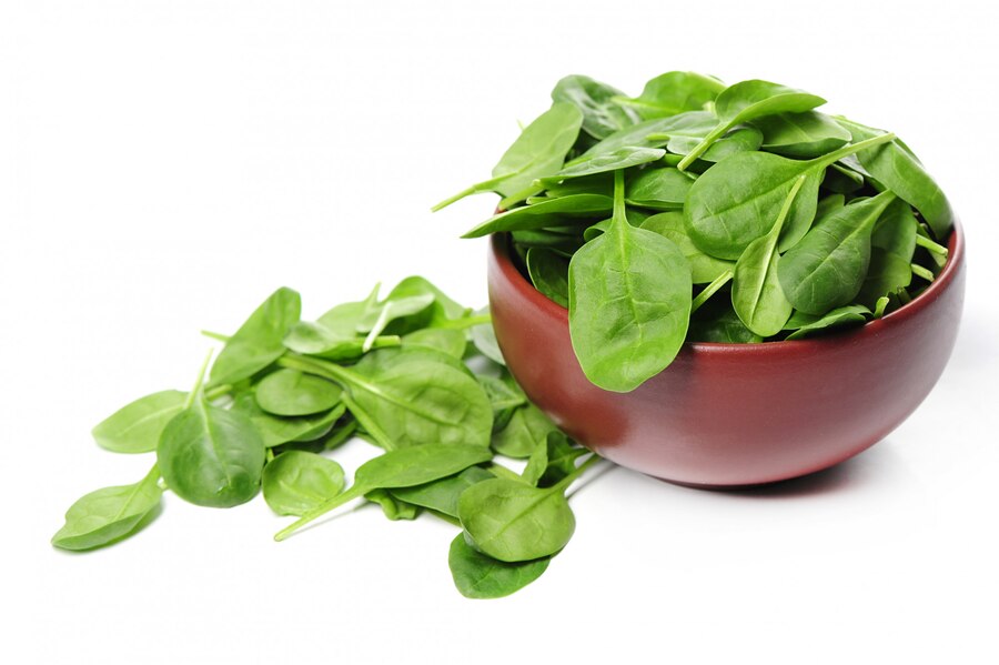 fresh spinach leaves bowl isolated