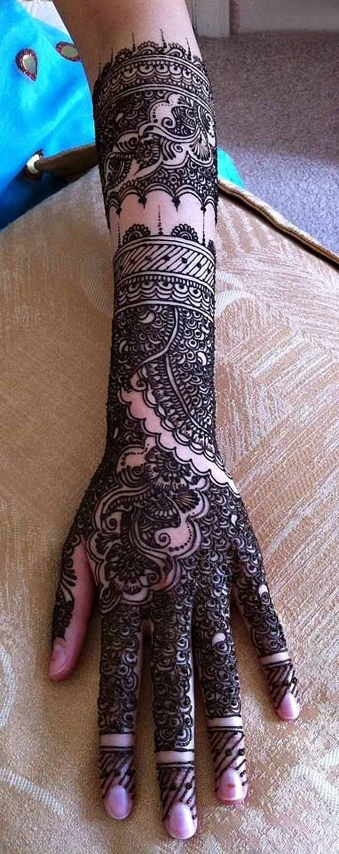 heavy mehndi design for brides with thin hands