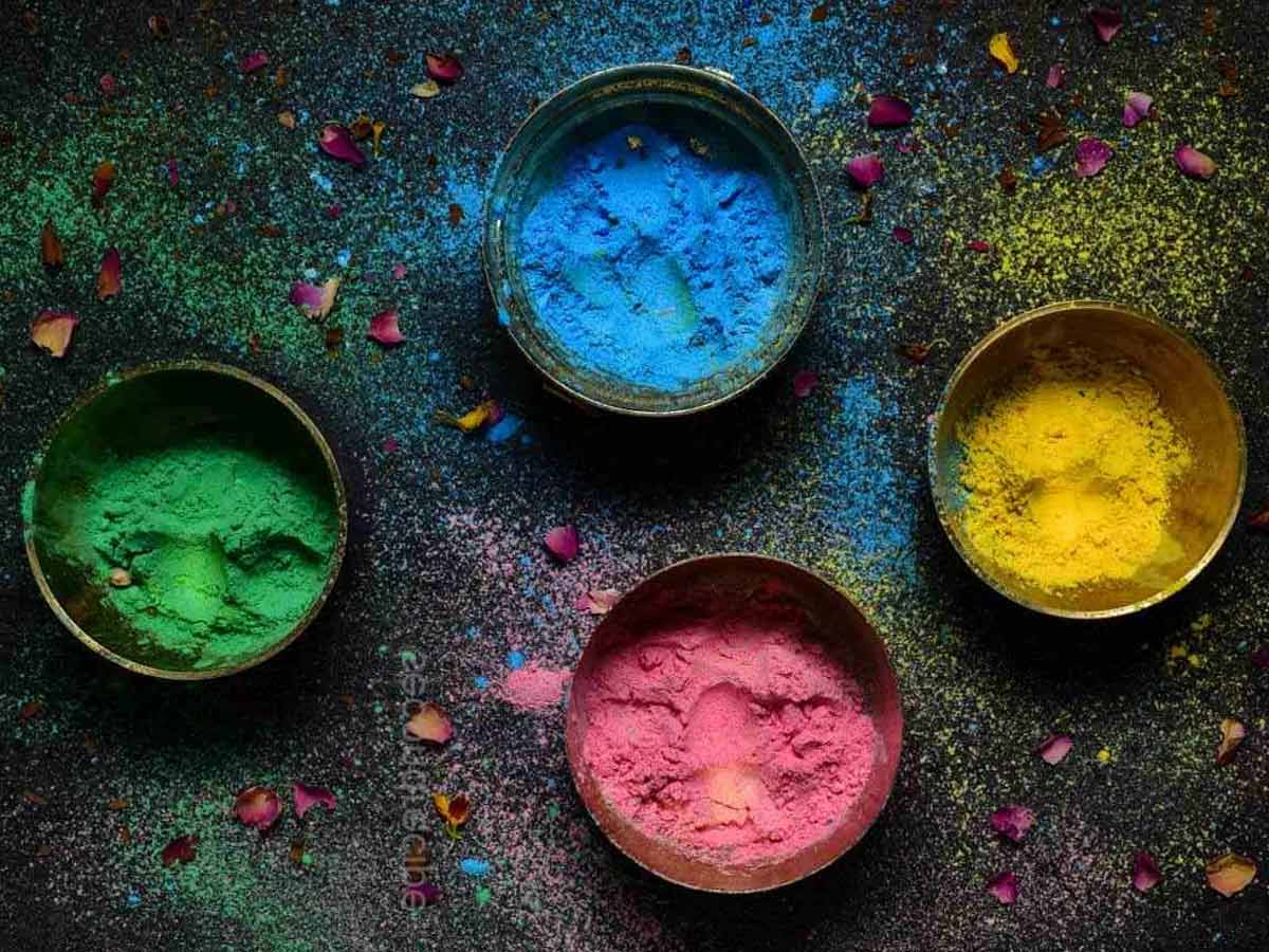 what does sprinkling gulal at home main door means