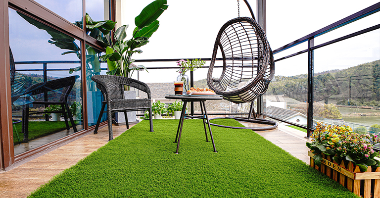 How do you maintain artificial grass in a balcony