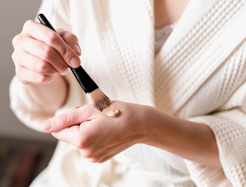 close up foundation applied hand