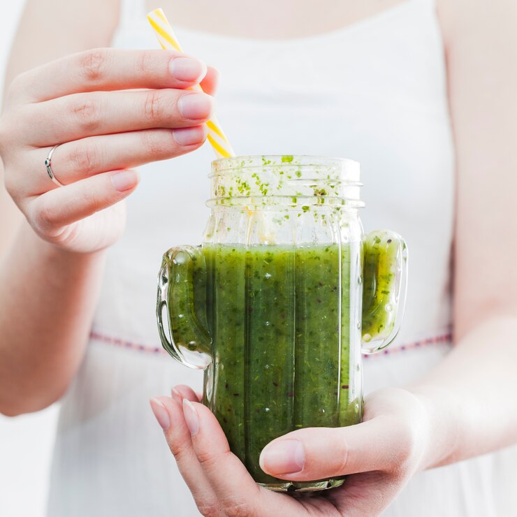 female holding jar with healthy smoothie