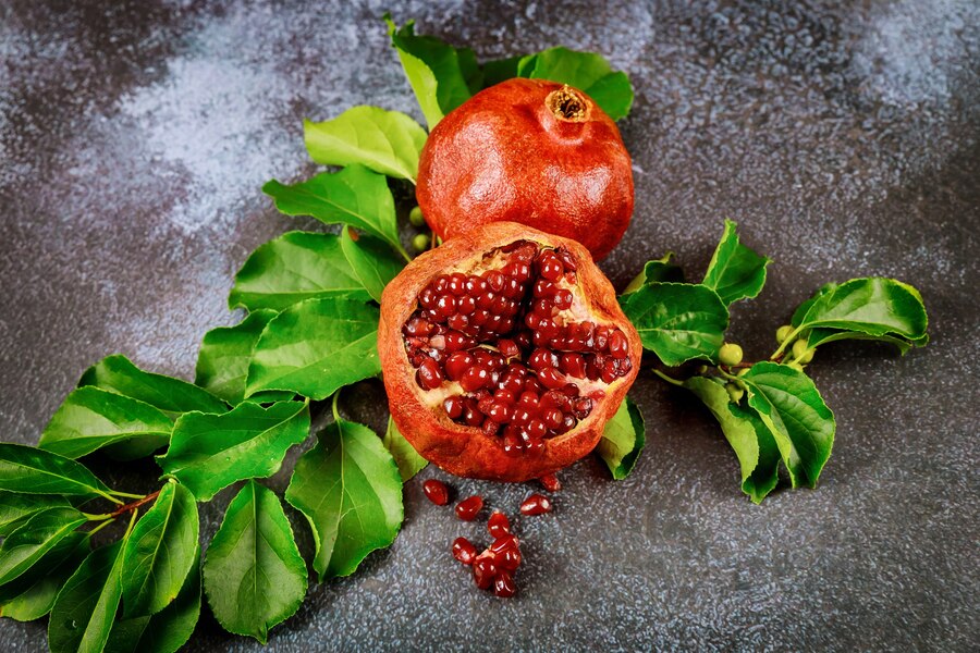pomegranate with green leaves