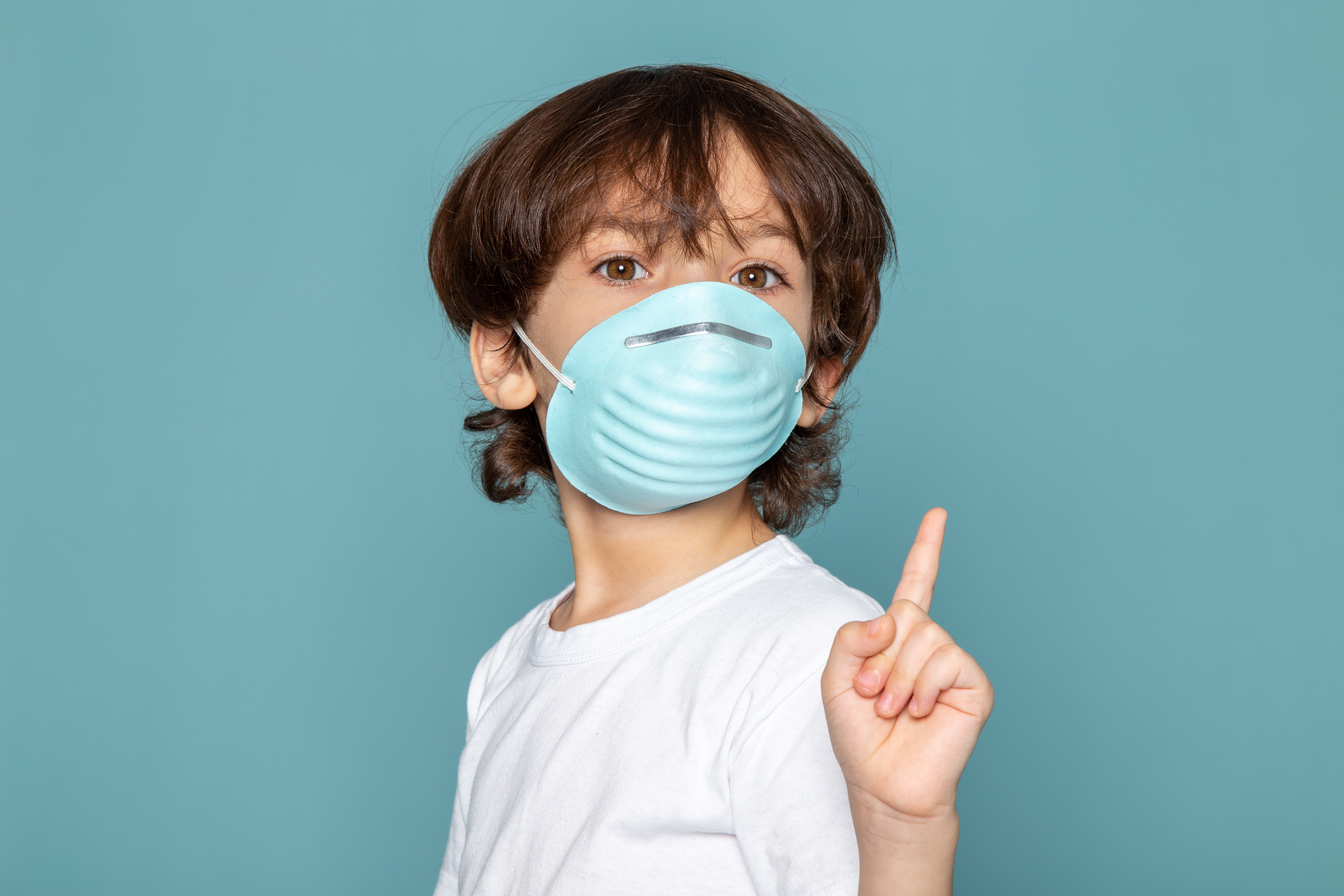 close-up-view-cute-little-boy-adorable-blue-sterile-protective-respiratory-mask-white-t-shirt-blue