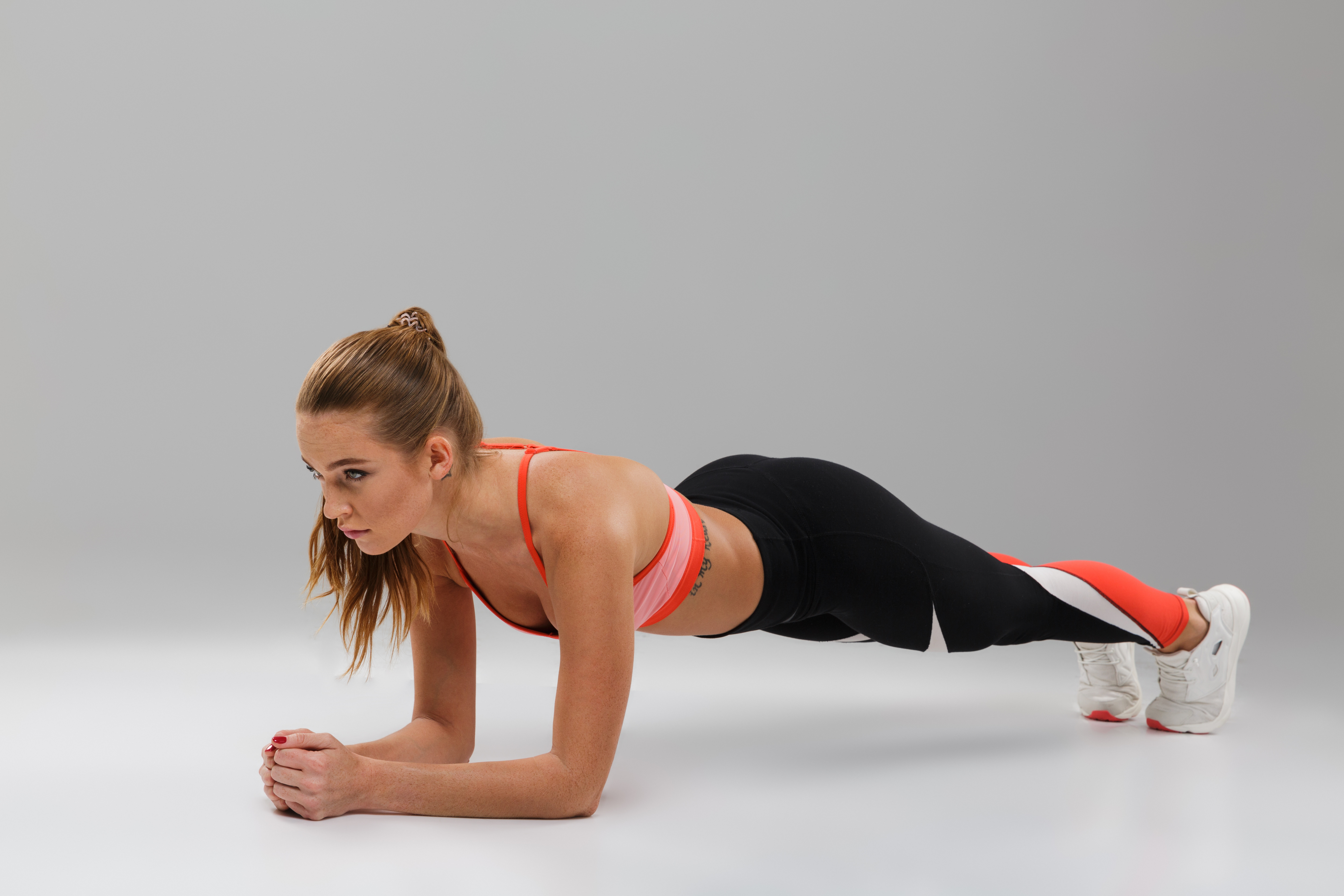 full-length-portrait-pretty-fit-sportsgirl-doing-plank