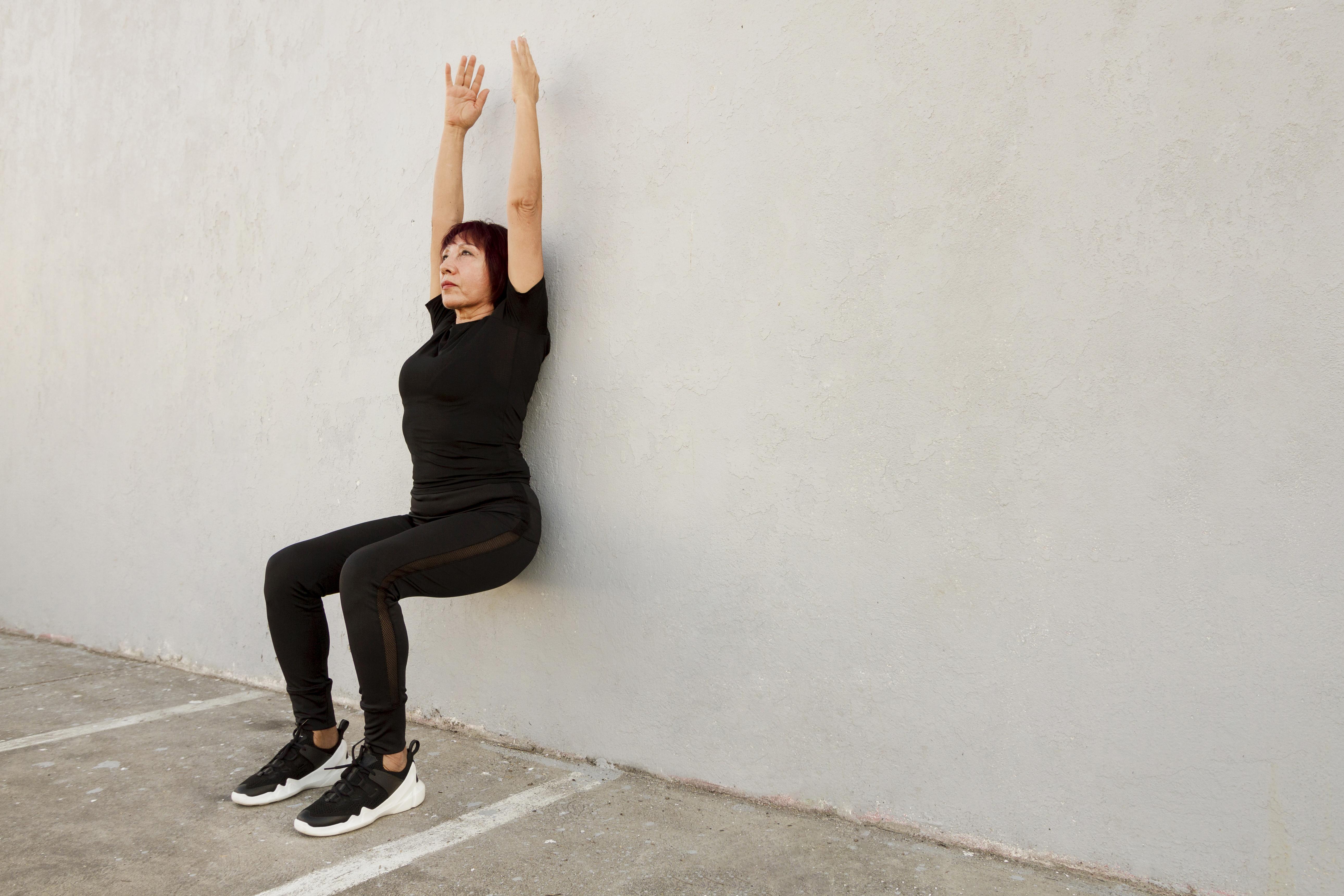 woman-doing-wall-stand-exercise