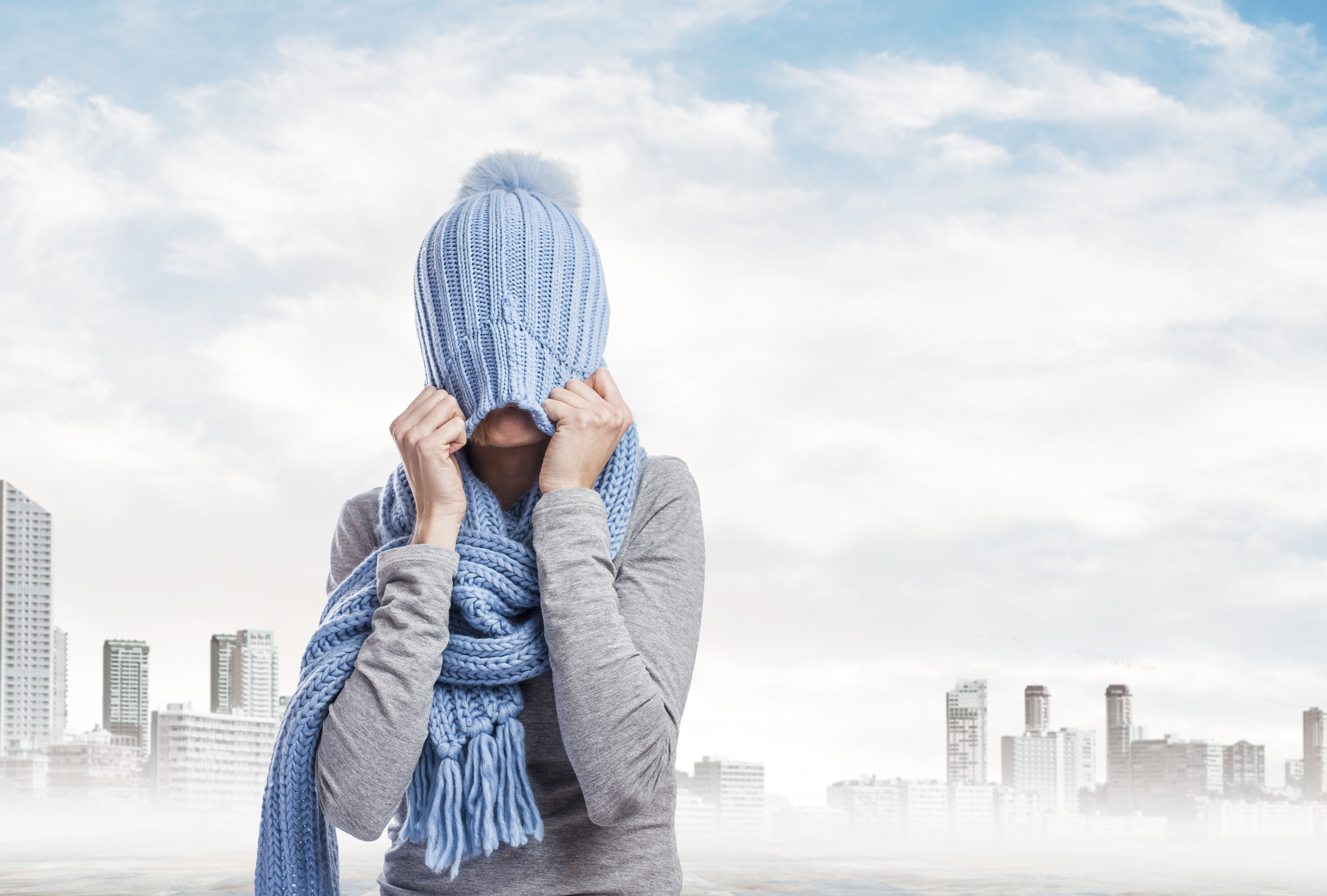 stressed-woman-covering-her-head-with-knit-cap