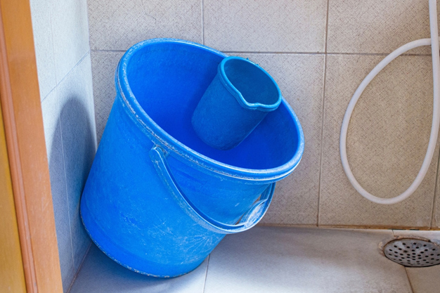 empty bucket at bathroom