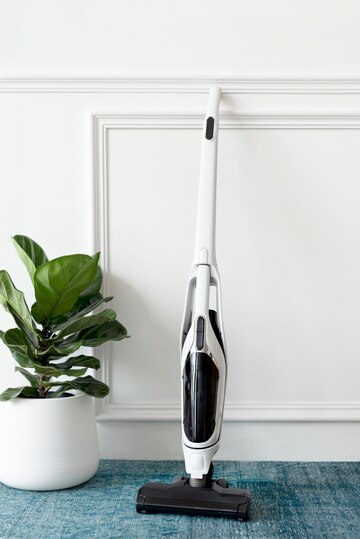 white-handheld-vacuum-cleaner-leaning-against-wall_53876-128137