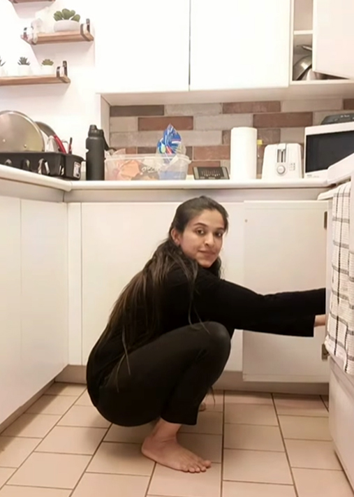 Malasana in kitchen