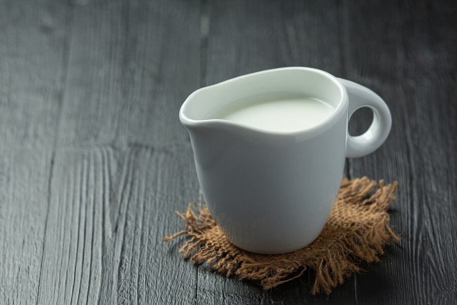 glass-milk-dark-wooden-surface_1150-41969