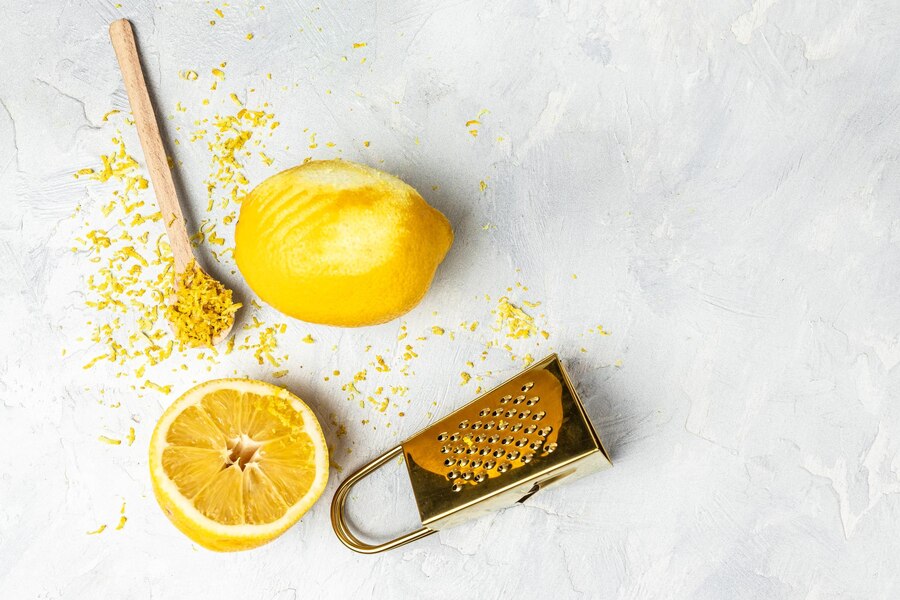 grating-lemon-zest-ready-cook-grater-peel-lemon-zest-light-background-banner-menu-recipe-top-view_114941-5197