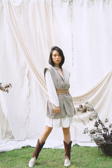 gorgeous-woman-standing-looking-garden_176474-8484