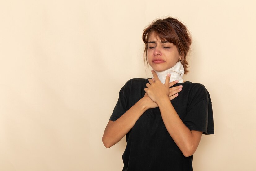front-view-sick-young-female-with-high-temperature-covering-her-throat-feeling-ill-white-desk_140725-31620