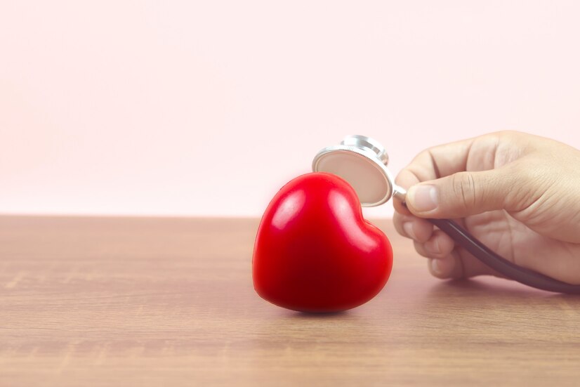 close-up-hand-use-medical-stethoscope-checking-red-heart_101448-1821