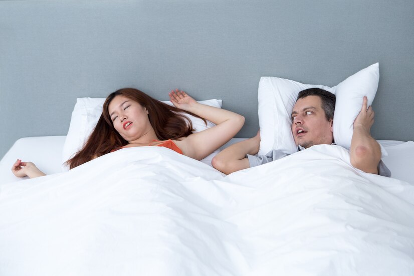snoring-woman-husband-covering-ears_1262-5824
