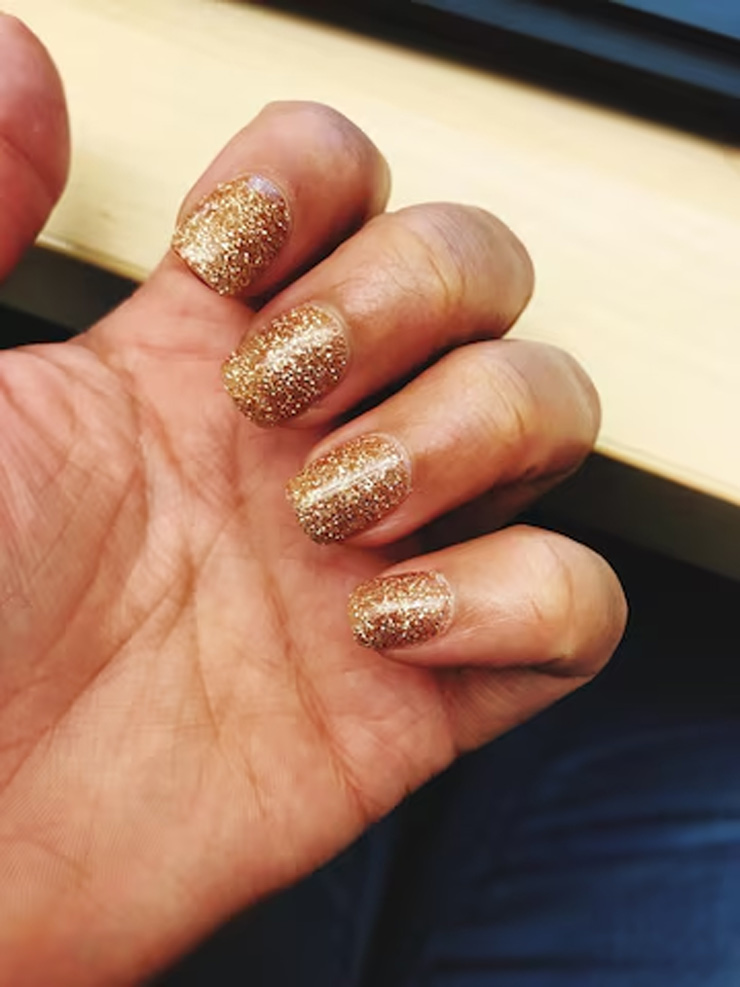 Golden glitter nail art