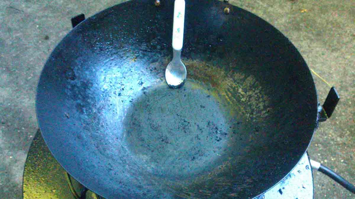 How to remove black coating from new iron Kadai