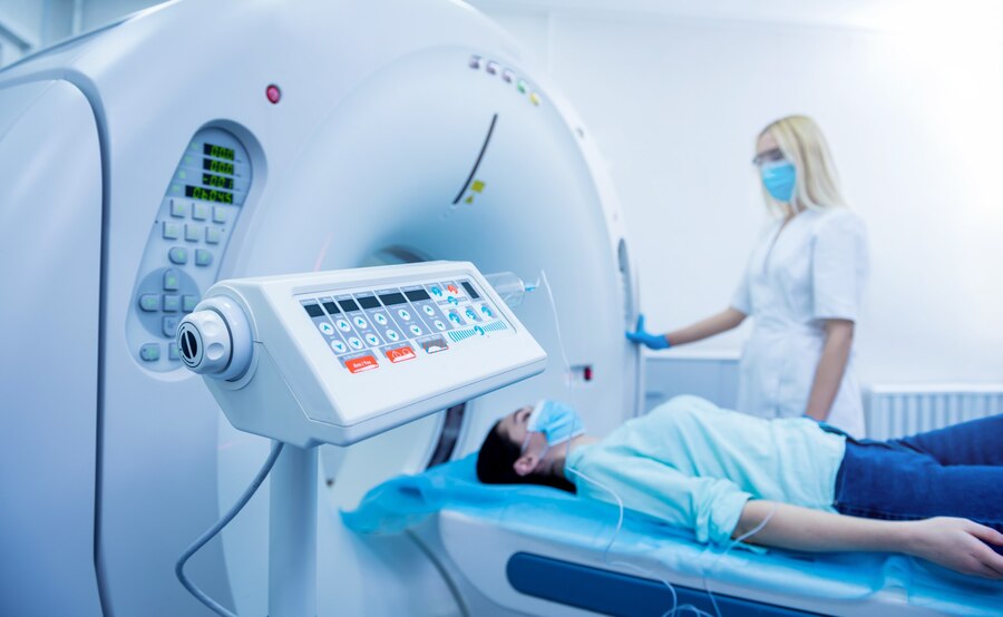 radiologist-with-female-patient-room-computed-tomography_179755-10890