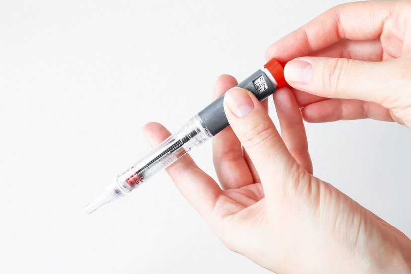 person-holds-insulin-pen-injection-sets-dose-medication_340805-19