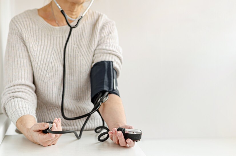 woman-measuring-blood-pressure-by-herself-home-with-manual-device-self-care-medical-concept_106885-1781