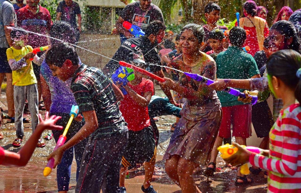 Why is Holi celebrated with colors in India