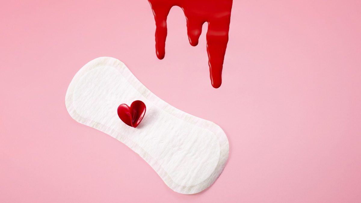 what does light red and pinkish period blood flow indicate