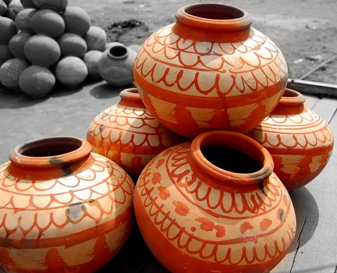 Place the pot on top of the sand