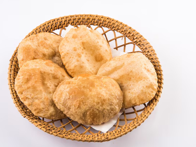 add ghee or oil on the poori