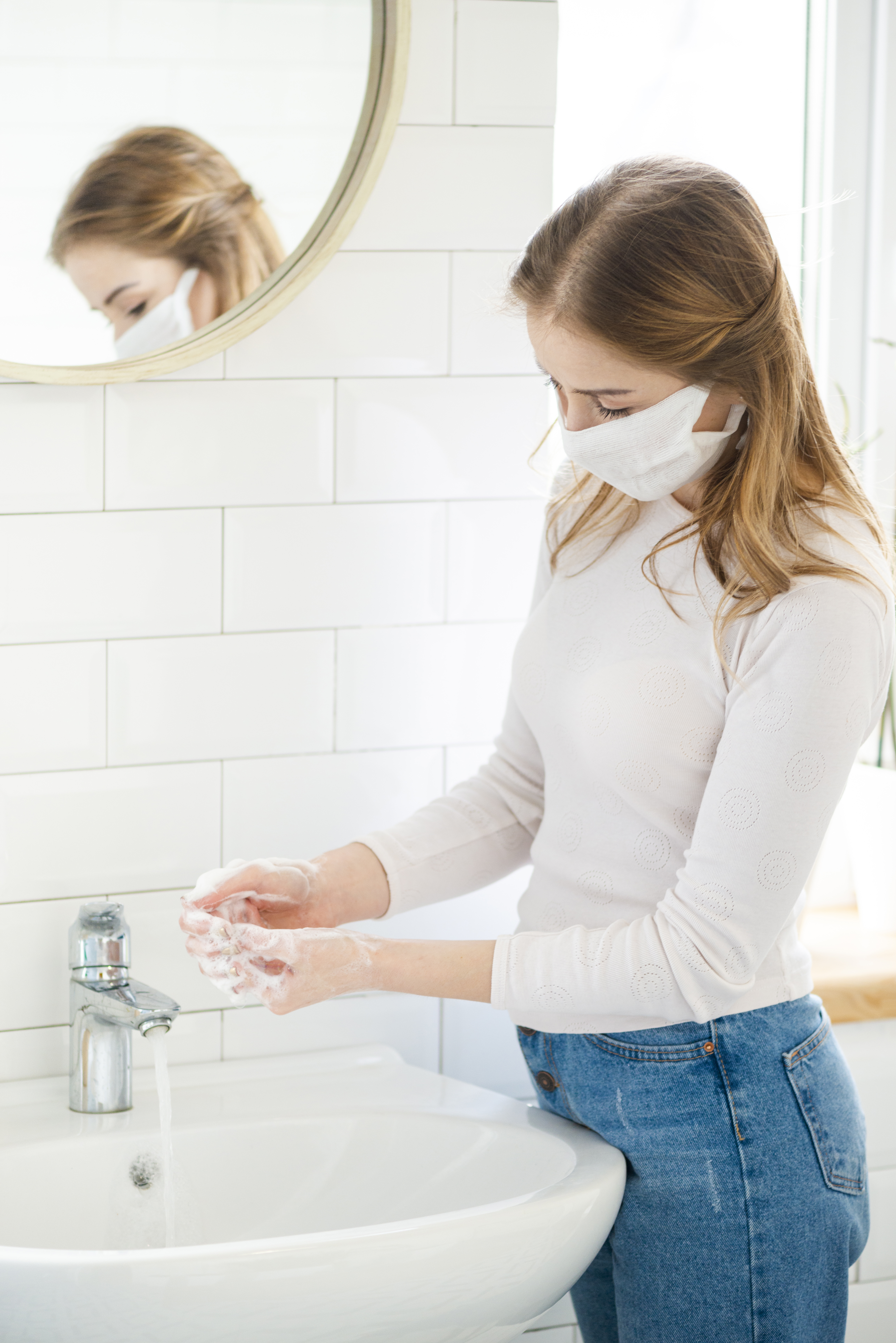 woman-washing-her-hands-bathroom