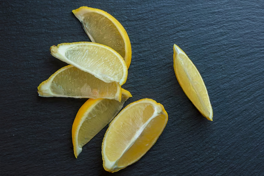 use hot lemon water to clean gas burner