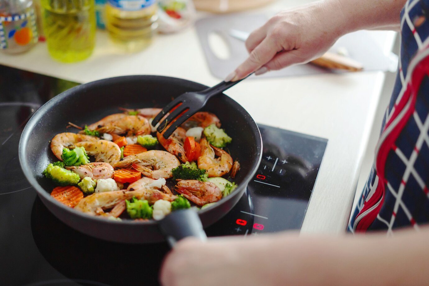 What are the disadvantages of an induction cooktop